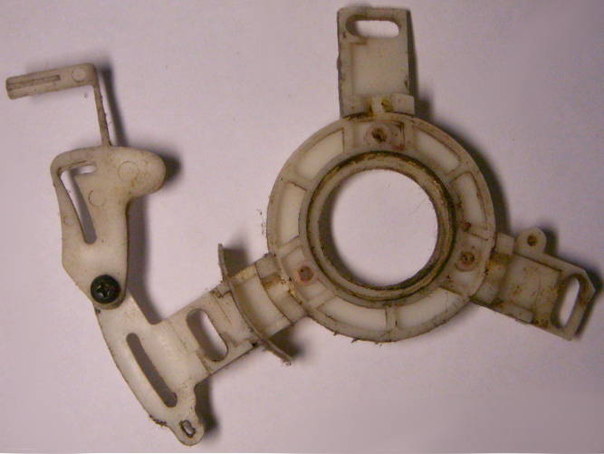 Flange panel tensioner mechanism/oil pump chain saw